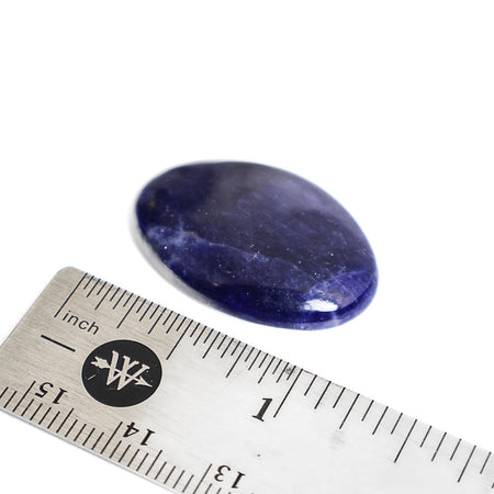Oval-shaped blue sodalite cabochon