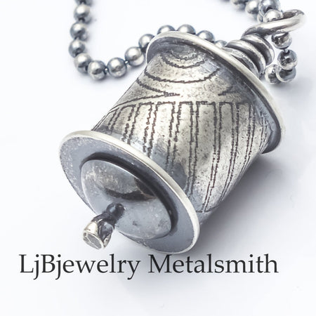 sterling silver hollow form pendant on beaded chain