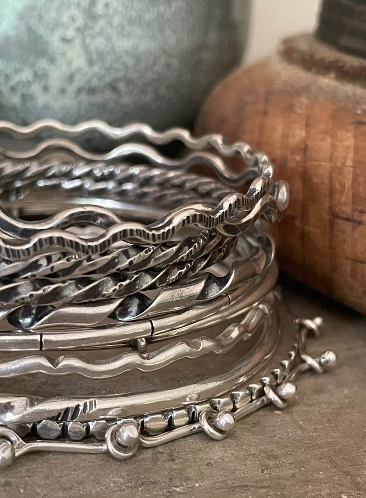 silver bangle and chain bracelets