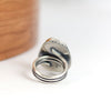 silver ring with a coil band on a white background