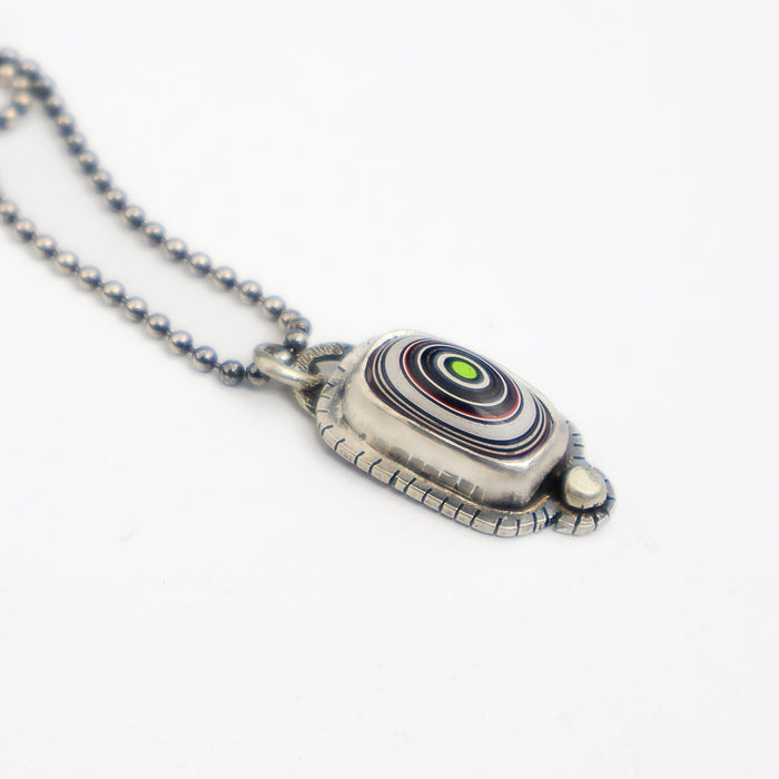 Necklace with a unique pendant on a white background
