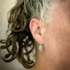 sterling silver dangle leaf earrings on ear