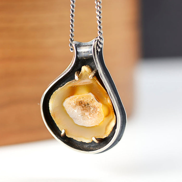 sterling silver and 14k gold pendant with an agate slice
