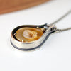 sterling silver and 14k gold pendant with an agate slice