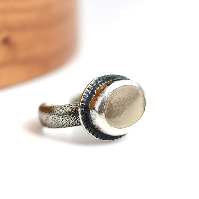 silver ring with a two toned color beach stone

