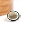 silver ring with a two toned color beach stone