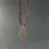 faceted garnet bead necklace with sterling silver hollow form