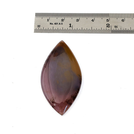 A oval-shaped polished agate gemstone with reddish-brown, amber, and dark brown colors, shown on a white background with a metal ruler above for scale.