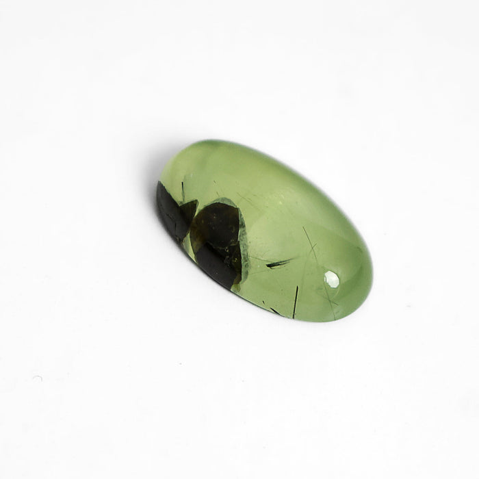 Green and black prehnite cabochon stone