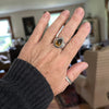 Handmade sterling silver ring  on a hand with high dome teardrop Namibia citrine, sand textured bezel frame and wide textured dome band with oxidized patina, size 9