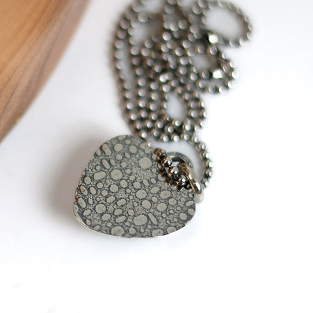 Turquoise necklace showing the textured backing of the pendant
