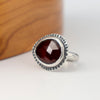 Handmade sterling silver ring with horizontal rose cut hessonite garnet, dot textured bezel border and half round comfort fit band, size 7