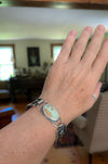 Sterling silver cuff bracelet with Royston turquoise from Nevada, reticulated silver detail, patina finish, handmade by LjB Jewelry, shown on wrist