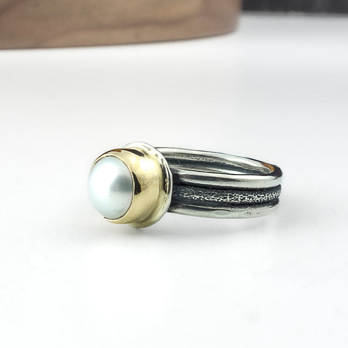 silver and gold pearl ring