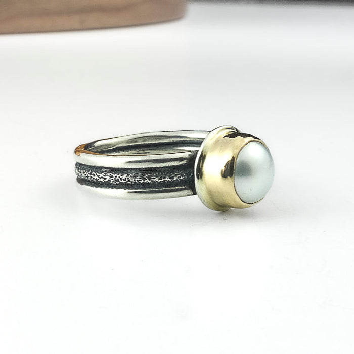 silver and gold pearl ring