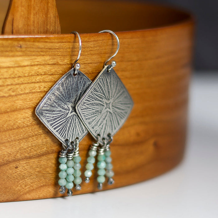 Silver earrings with starburst design and aquamarine beads 