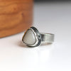 Silver ring with a white beach stone