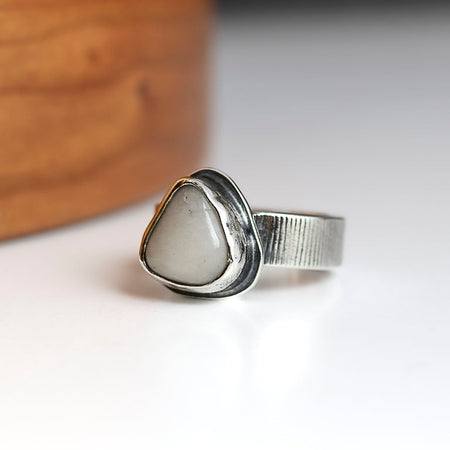 Silver ring with a white beach stone