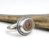 sterling silver ring with a bezel set fordite cabochon
