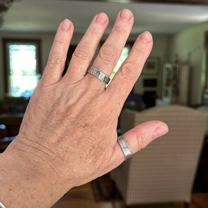 sterling silver textured ring band on hand