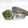 Sterling silver cuff bracelet with green turquoise and black matrix, textured band, patina finish, handmade by LjB Jewelry