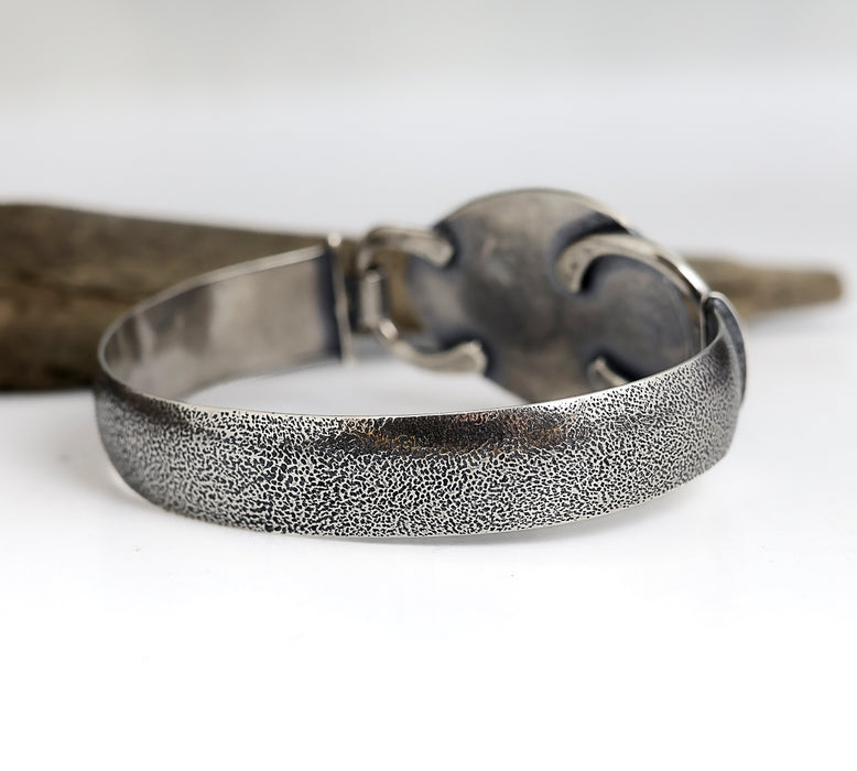 Sterling silver cuff bracelet with green turquoise and black matrix, textured band, patina finish, handmade by LjB Jewelry