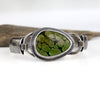 Sterling silver cuff bracelet with green turquoise and black matrix, textured band, patina finish, handmade by LjB Jewelry