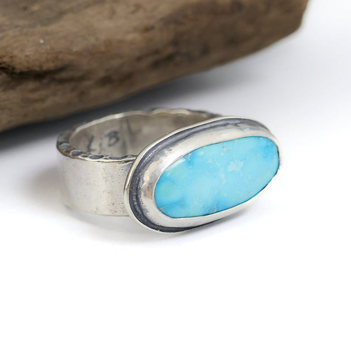 Sterling silver ring with soft blue Blue Ridge Orvil Jack turquoise from Nevada, wide band with dimpled edge texture, handmade by LjB Jewelry