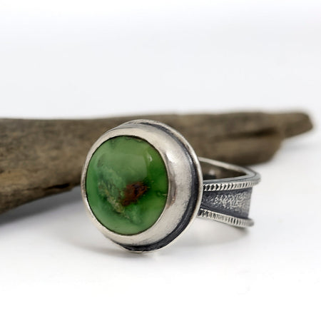 Sterling silver ring with bright green Emerald Valley turquoise from Nevada, tapered band with sand and line textures, handmade by LjB Jewelry