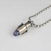 Handmade sterling silver tube pendant with riveted nesting tubes holding a lavender blue chalcedony point, oxidized patina, on an oval bead chain