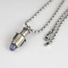 Handmade sterling silver tube pendant with riveted nesting tubes holding a lavender blue chalcedony point, oxidized patina, on an oval bead chain