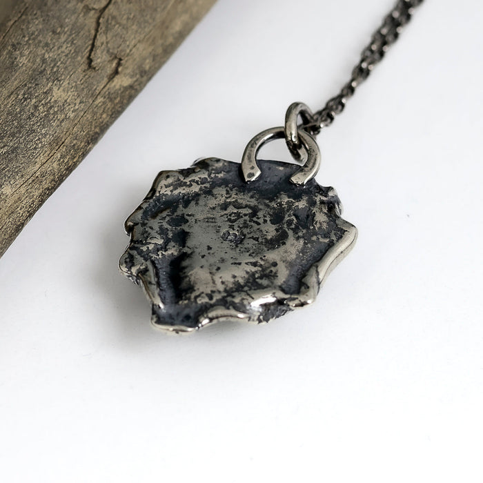Sterling silver necklace with Sierra Bella turquoise from Sonora Mexico on reticulated silver base with free form edges, patina finish, handmade by LjB Jewelry