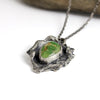 Sterling silver necklace with Sierra Bella turquoise from Sonora Mexico on reticulated silver base with free form edges, patina finish, handmade by LjB Jewelry