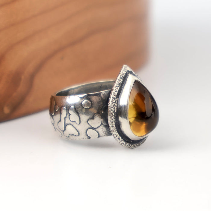 Handmade sterling silver ring with high dome teardrop Namibia citrine, sand textured bezel frame and wide textured dome band with oxidized patina, size 9