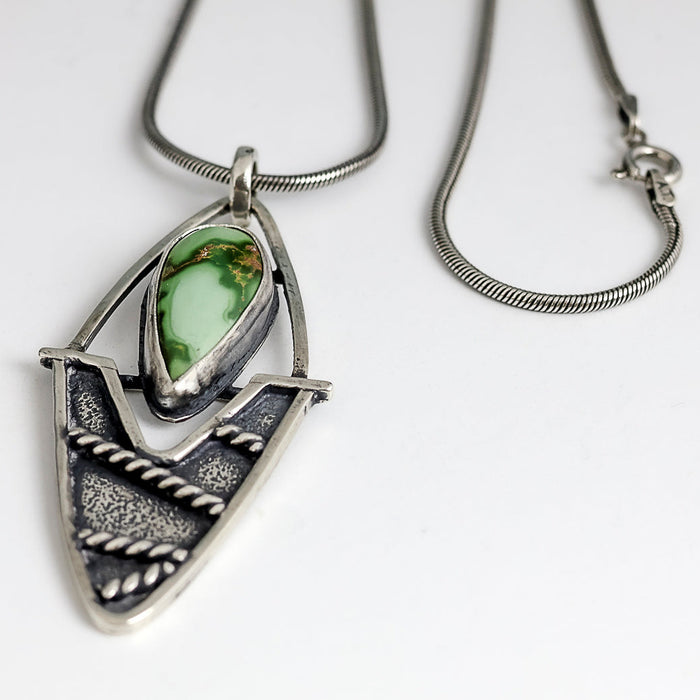 Sterling silver pendant necklace with Sierra Bella turquoise from Sonora Mexico, textured shield shape with twisted wire, patina finish, handmade by LjB Jewelry