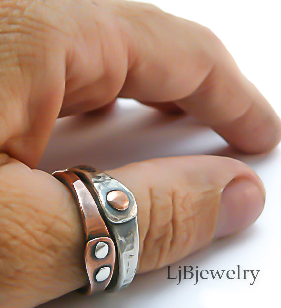 mixed metal stacking thumb ring on hand