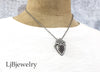 coral heart fossil sterling silver pendant