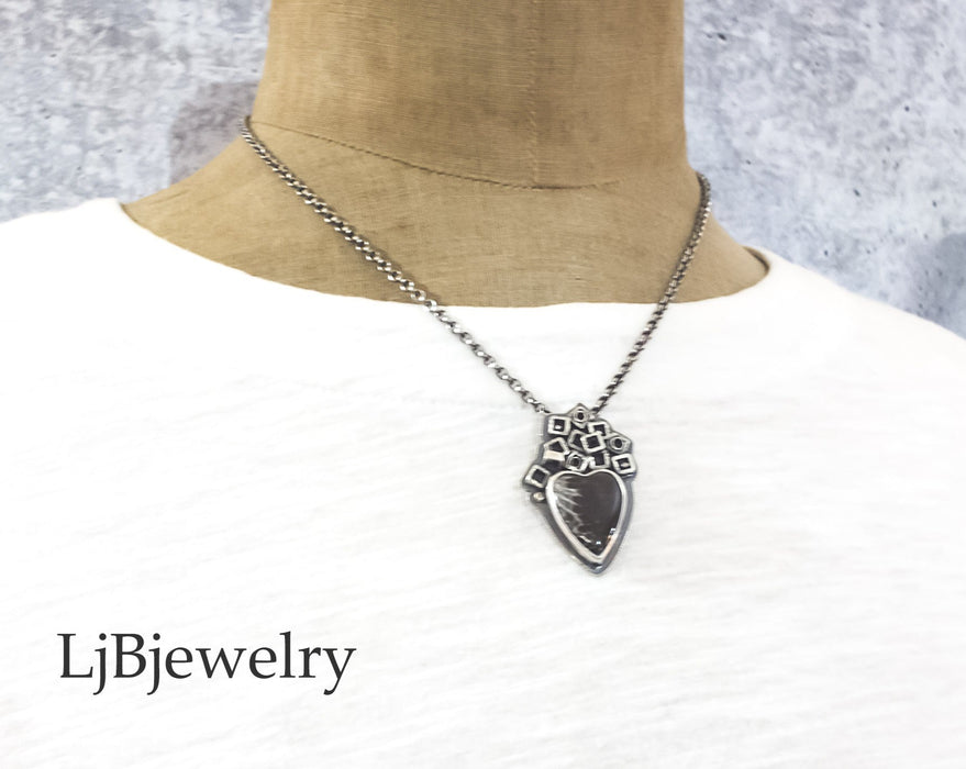 coral heart fossil sterling silver pendant