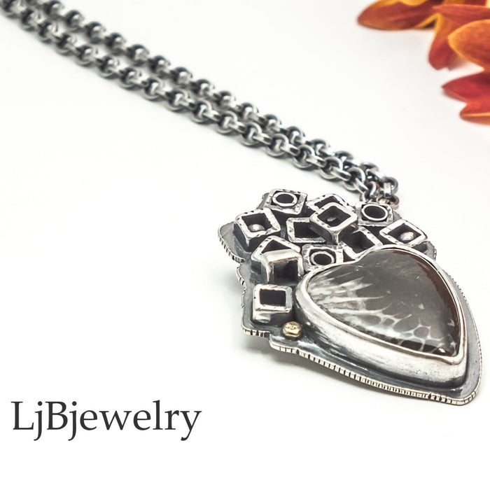 sterling silver coral heart fossil pendant