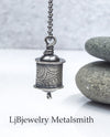 sterling silver hollow form pendant on beaded chain