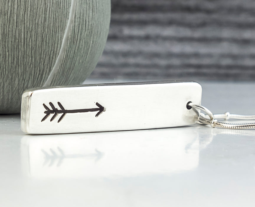 sterling silver hollow form pendant with pierced arrow