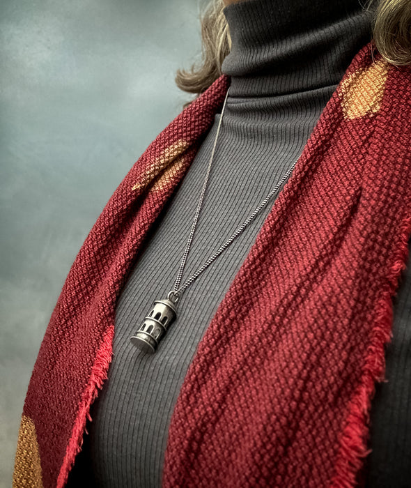 sterling silver tower pendant on neck
