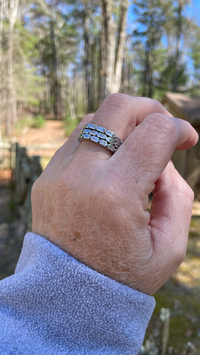 sterling silver stacking rings on hand